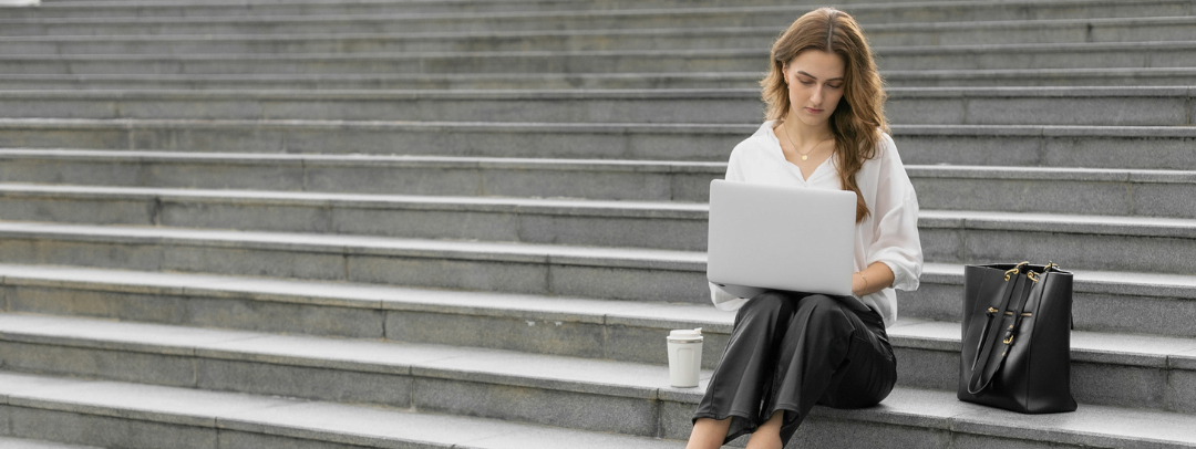 business woman working quietly on steps.